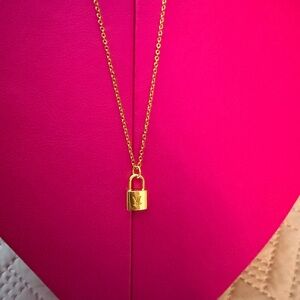 Upcycled LV charm on a necklace